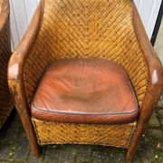 2 colonial armchairs in wood, rattan and leather, 1950s