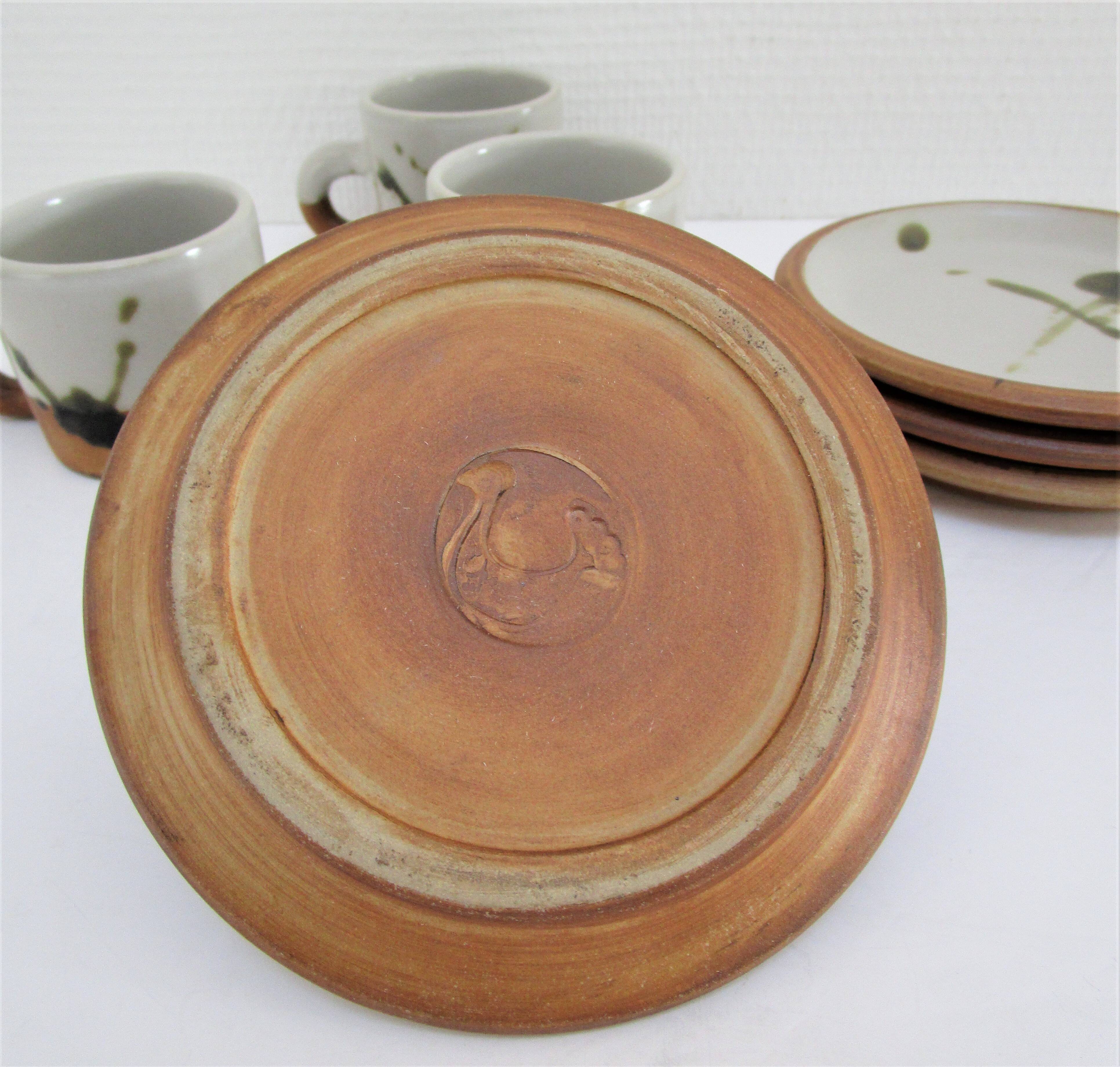 Four pottery cups and saucers from La Colombe Vallauris
