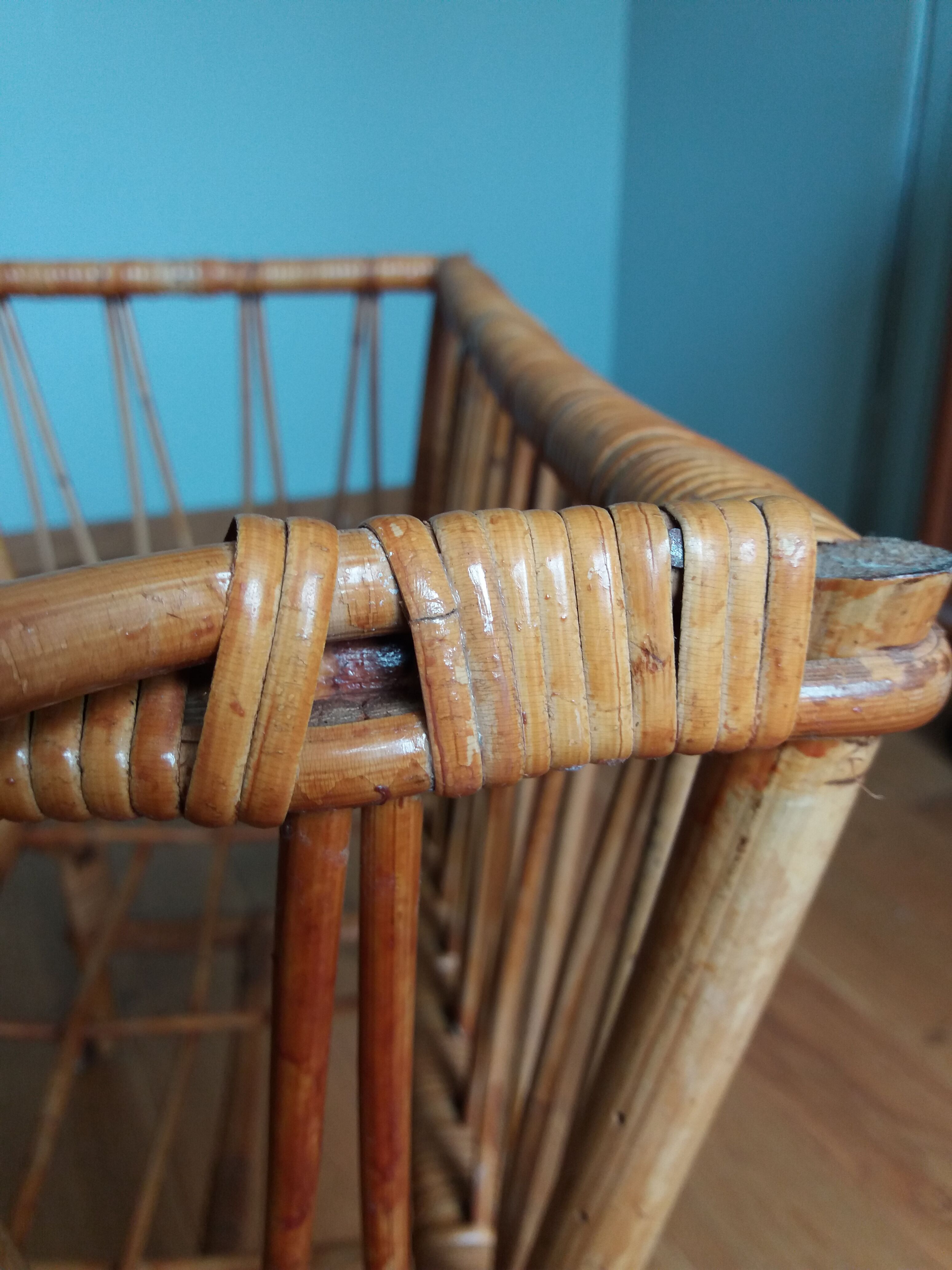 Rattan wicker cradle on wooden wheels
