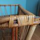 Rattan wicker cradle on wooden wheels
