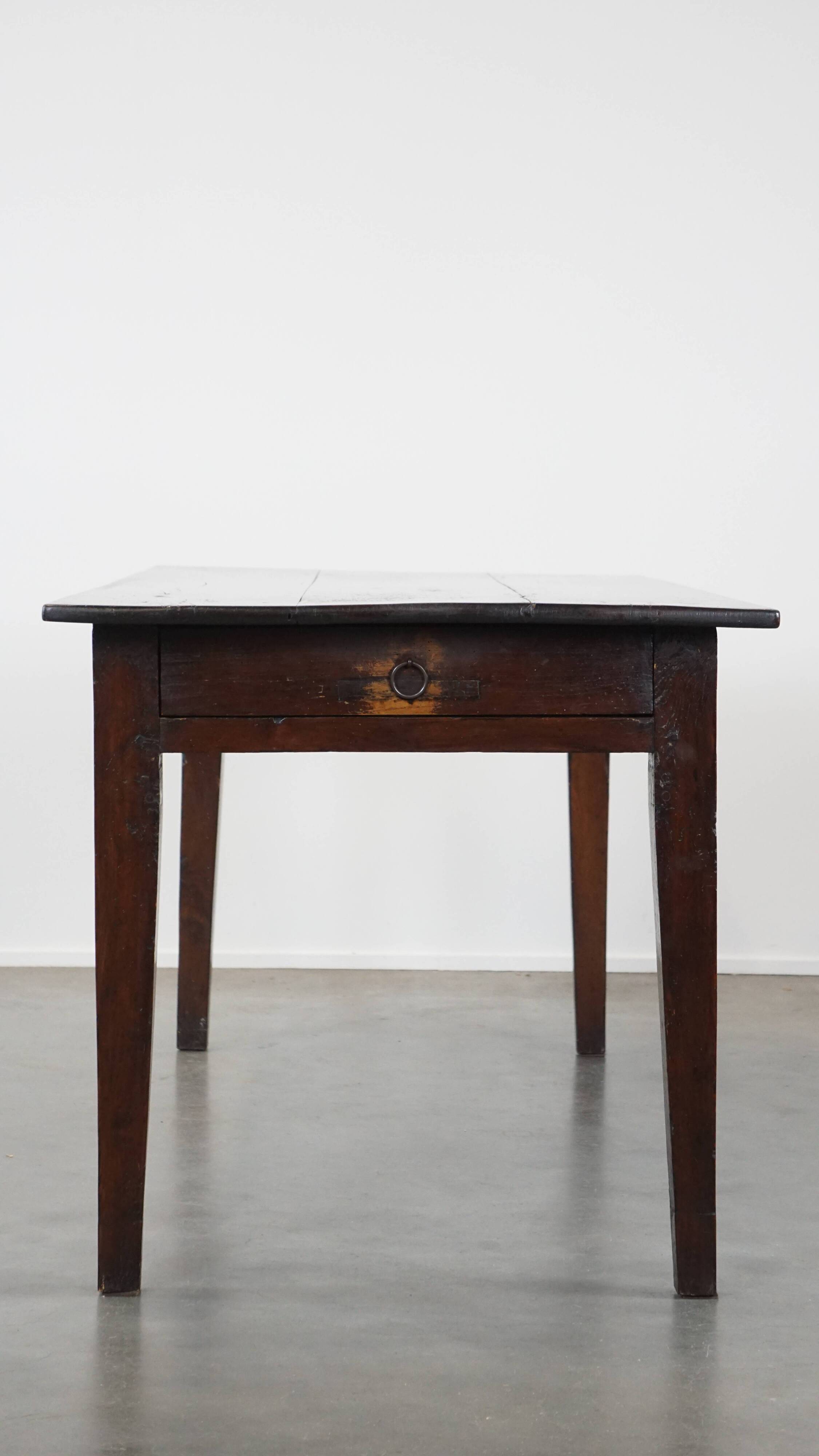 Antique French fruitwood dining table with 2 drawers and patina