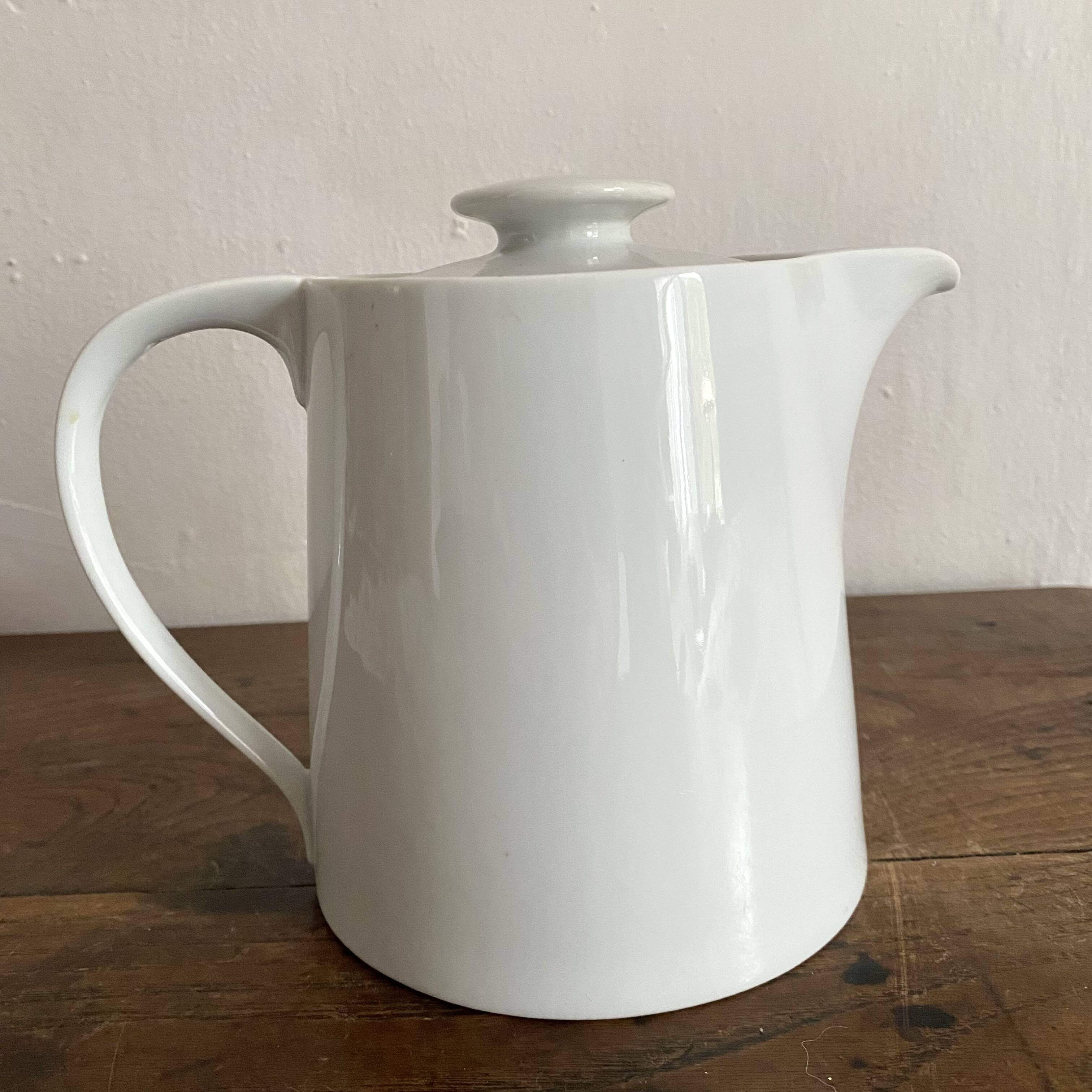 Porcelain teapot with hand-painted bird decoration