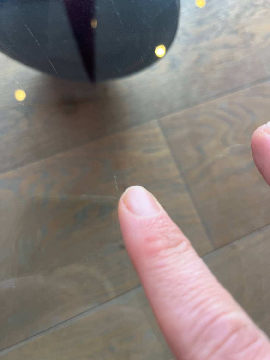 Gae Aulenti coffee table for Fontana Arte, transparent glass top with black cast iron supports, 1980s.