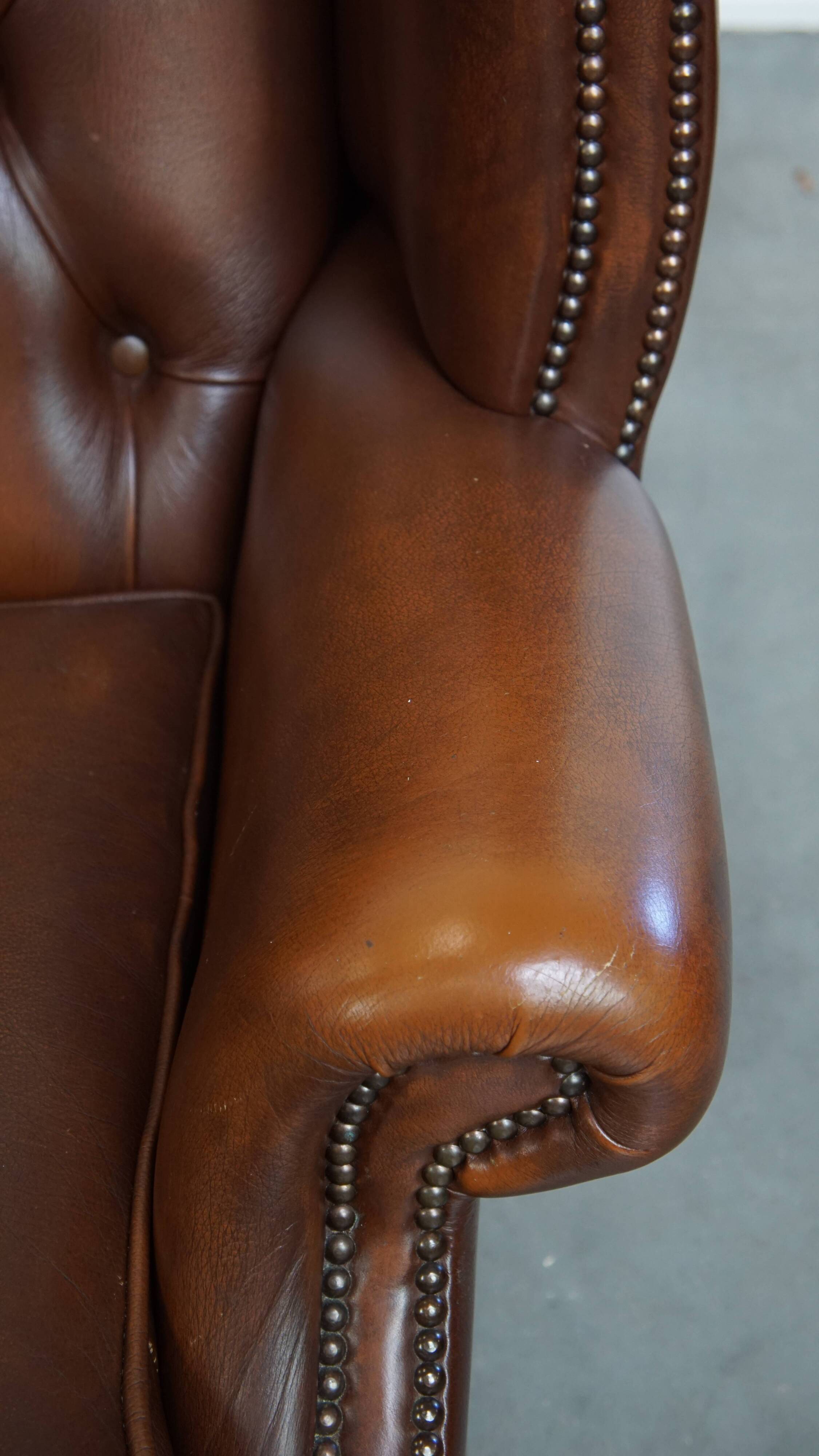 Chesterfield wing chair in dark brown English cowhide