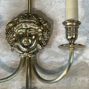 Pair of Two-Arm Bronze Wall Lights with Arrow and Mask Decoration