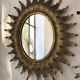 Miroir doré soleil fleuri ancien