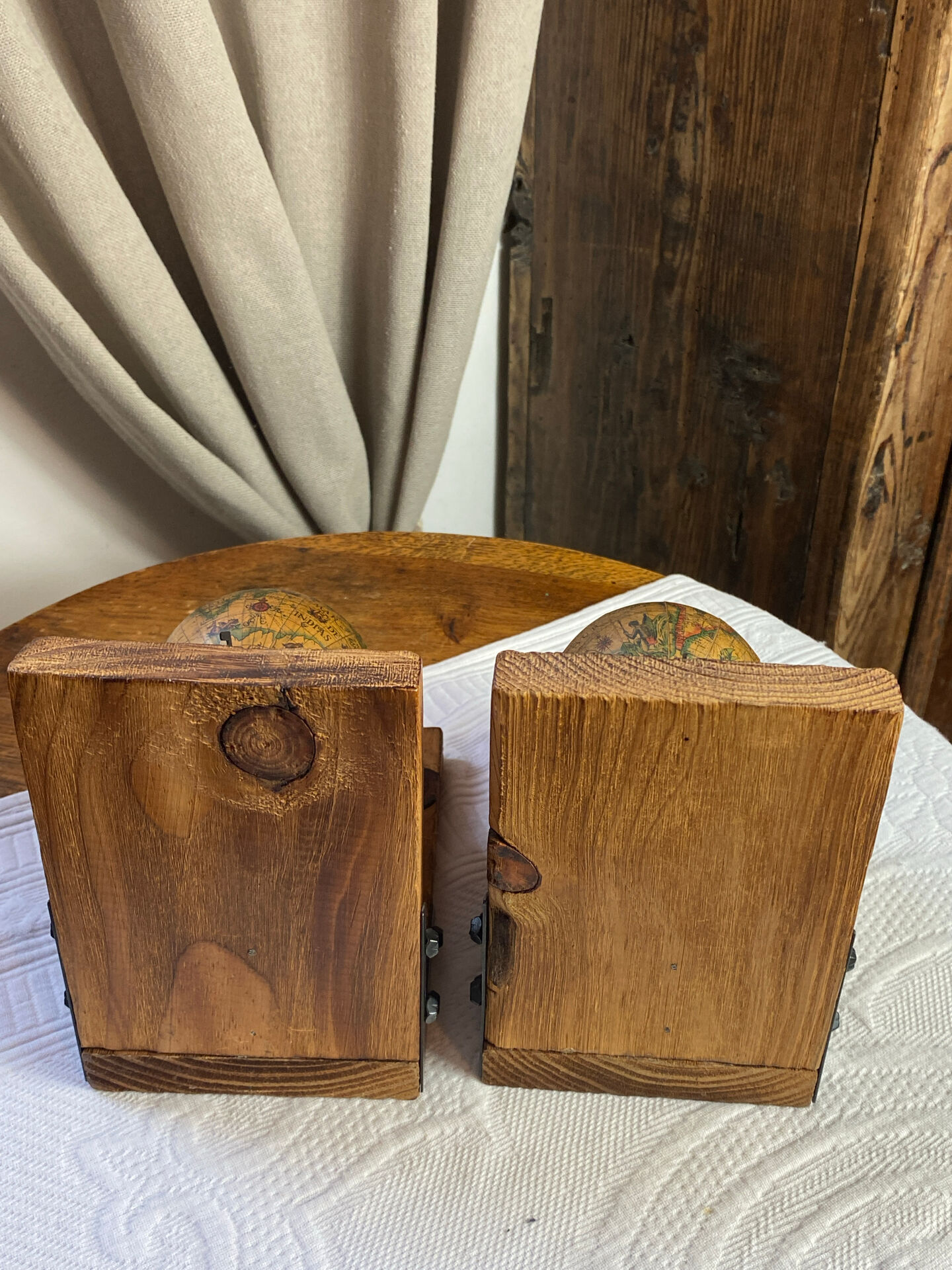 Pair of wooden bookends, rotating globes