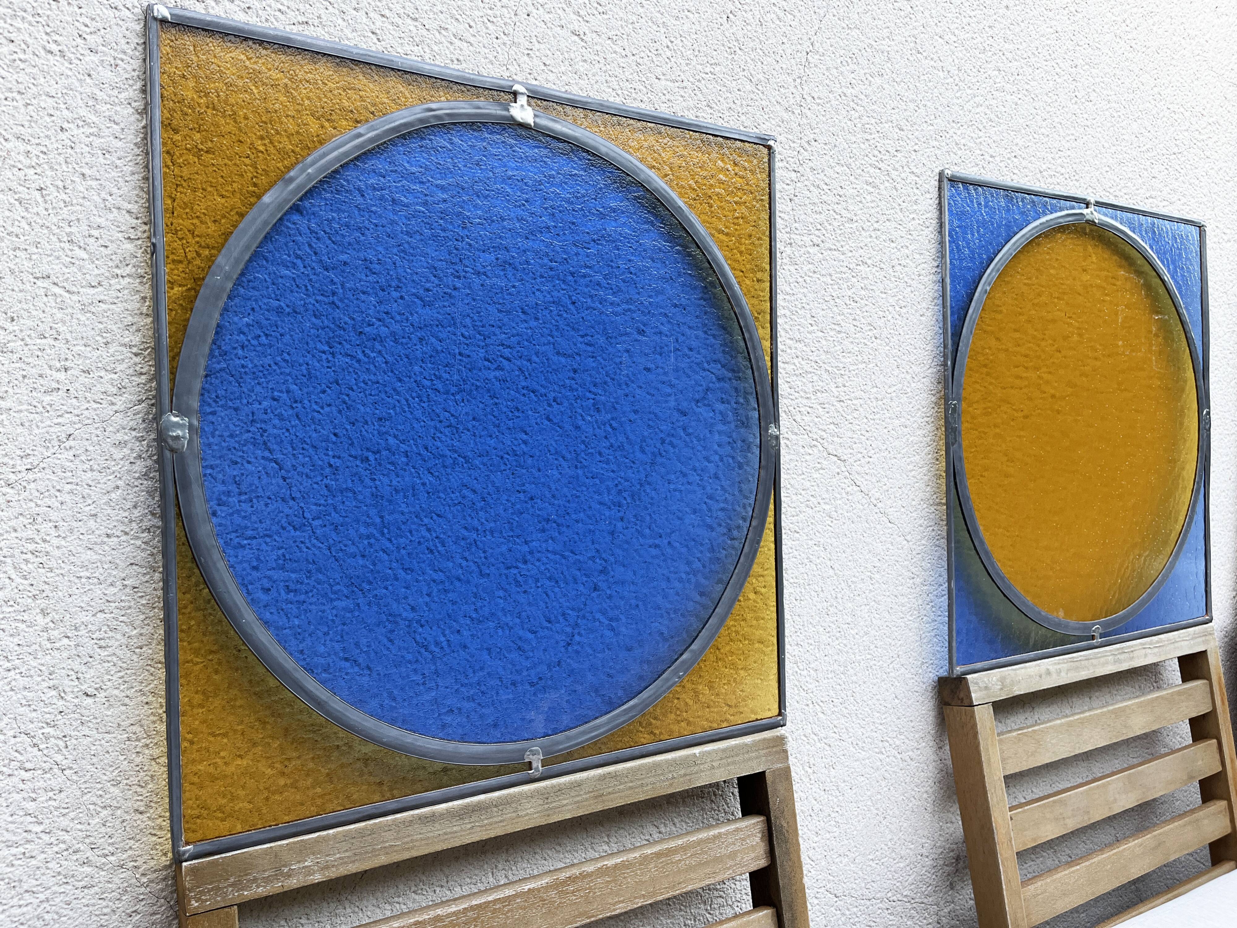 Pair of antique blue and yellow stained glass windows