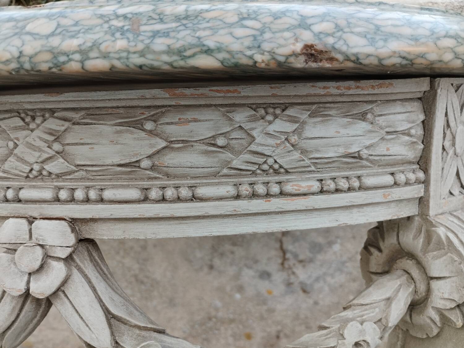 Beautiful antique wooden console with a marble top in Louis XVI style.