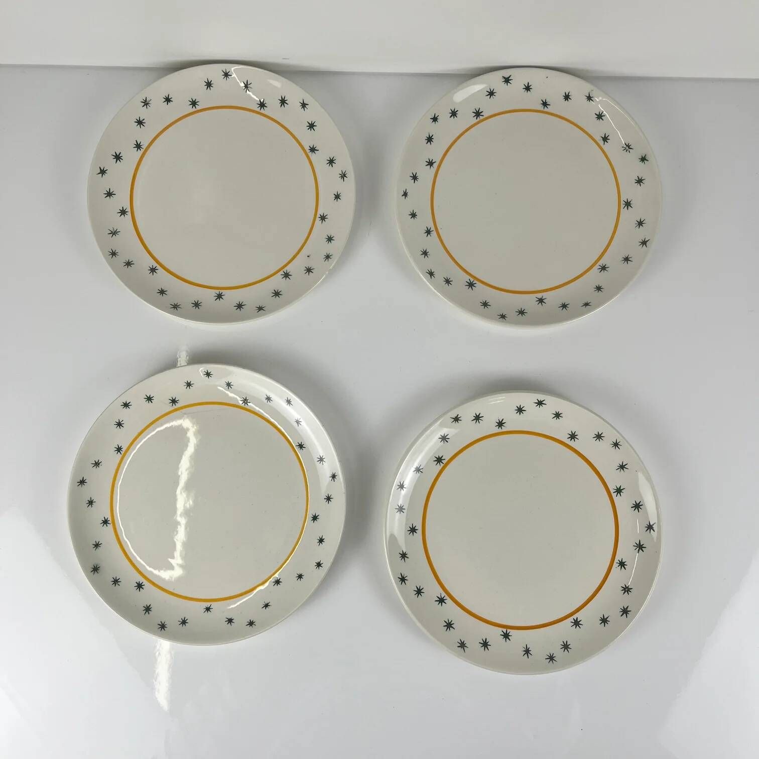 Set of 4 dessert plates GIEN, Primefleur creation, model "Constellation", 1950.