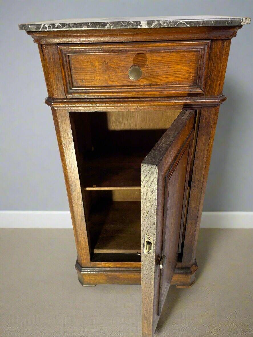 Provincial antique bedside table in oak, marble top, late 19th century.