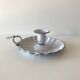 Candlestick in white enameled metal