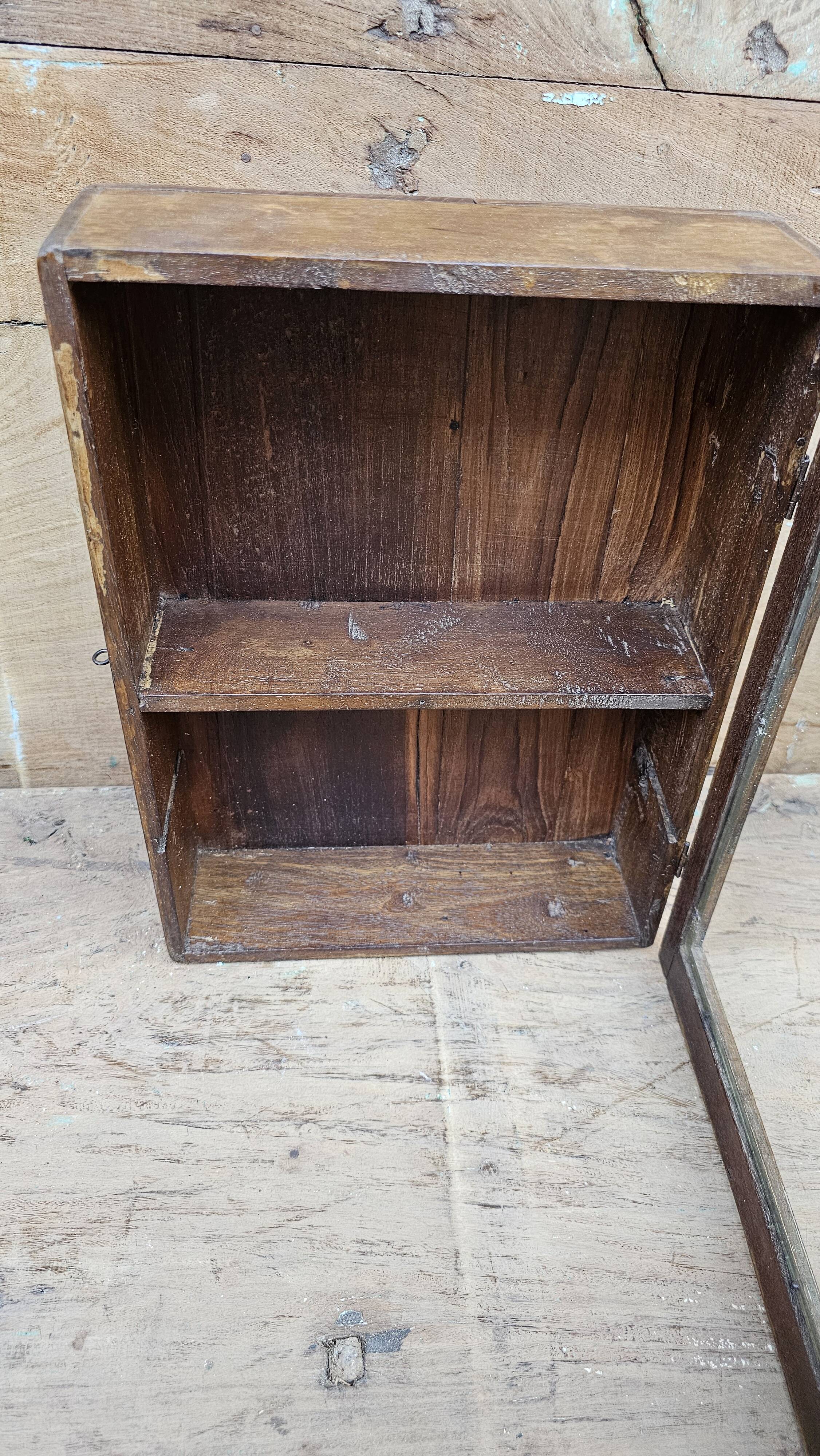 Old Art Deco wall display case in Burmese teak