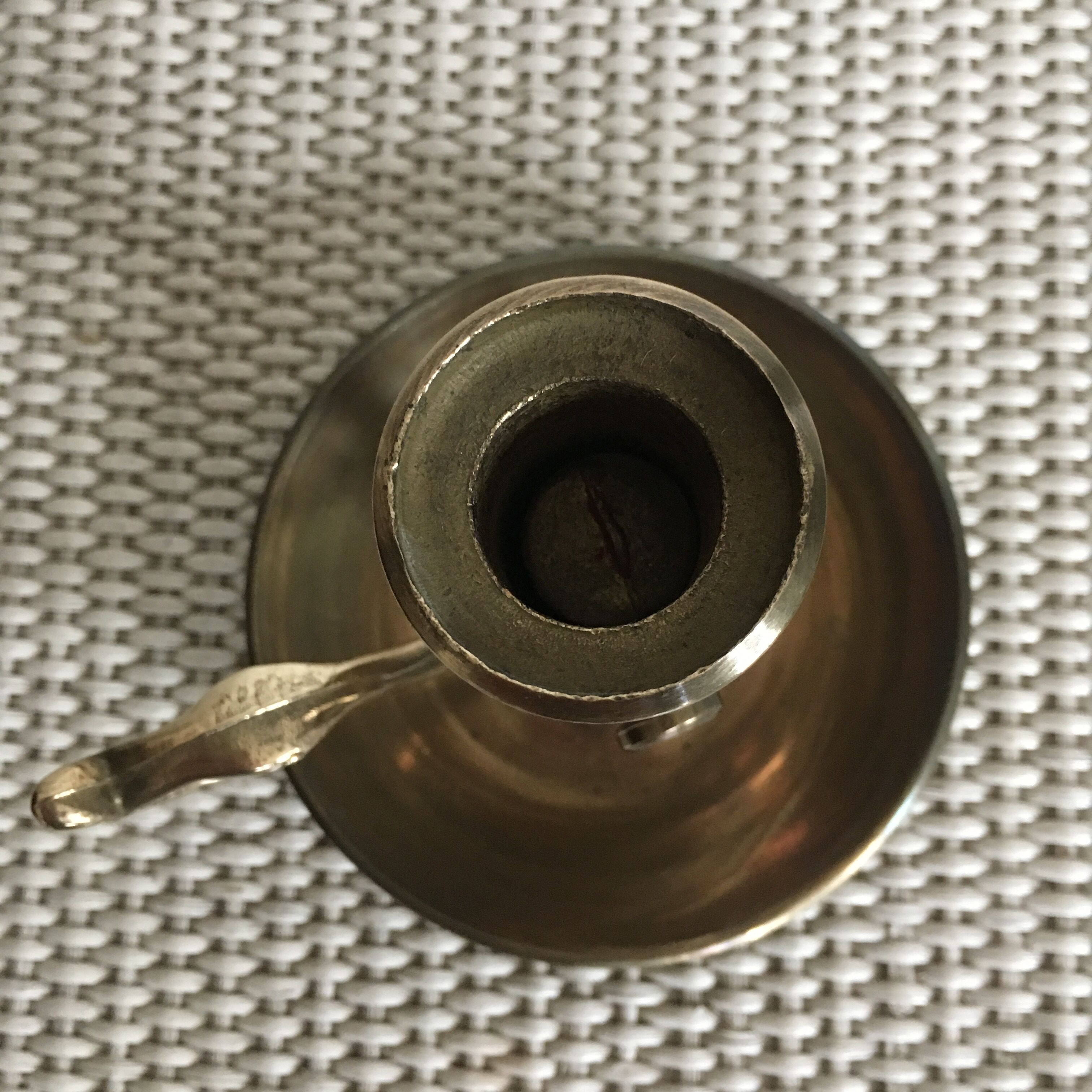 Old brass candlestick called "rat tail"