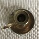 Old brass candlestick called "rat tail"