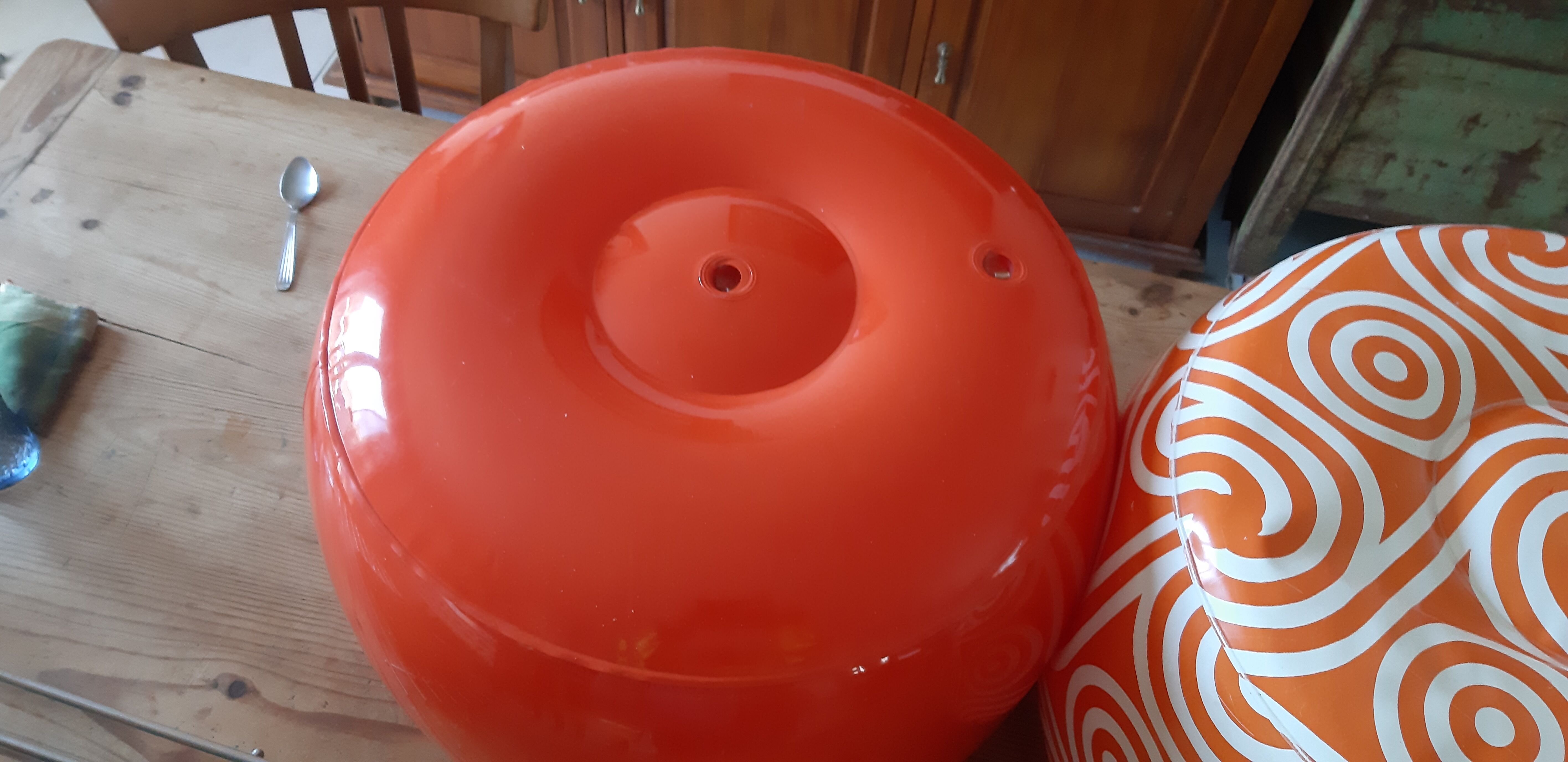2 vintage inflatable poufs in orange plastic