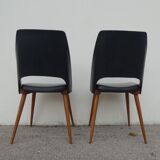 2 chaises en skaï noir pieds compas Louis Paolozzi