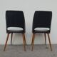 2 chairs in black skai compass legs Louis Paolozzi