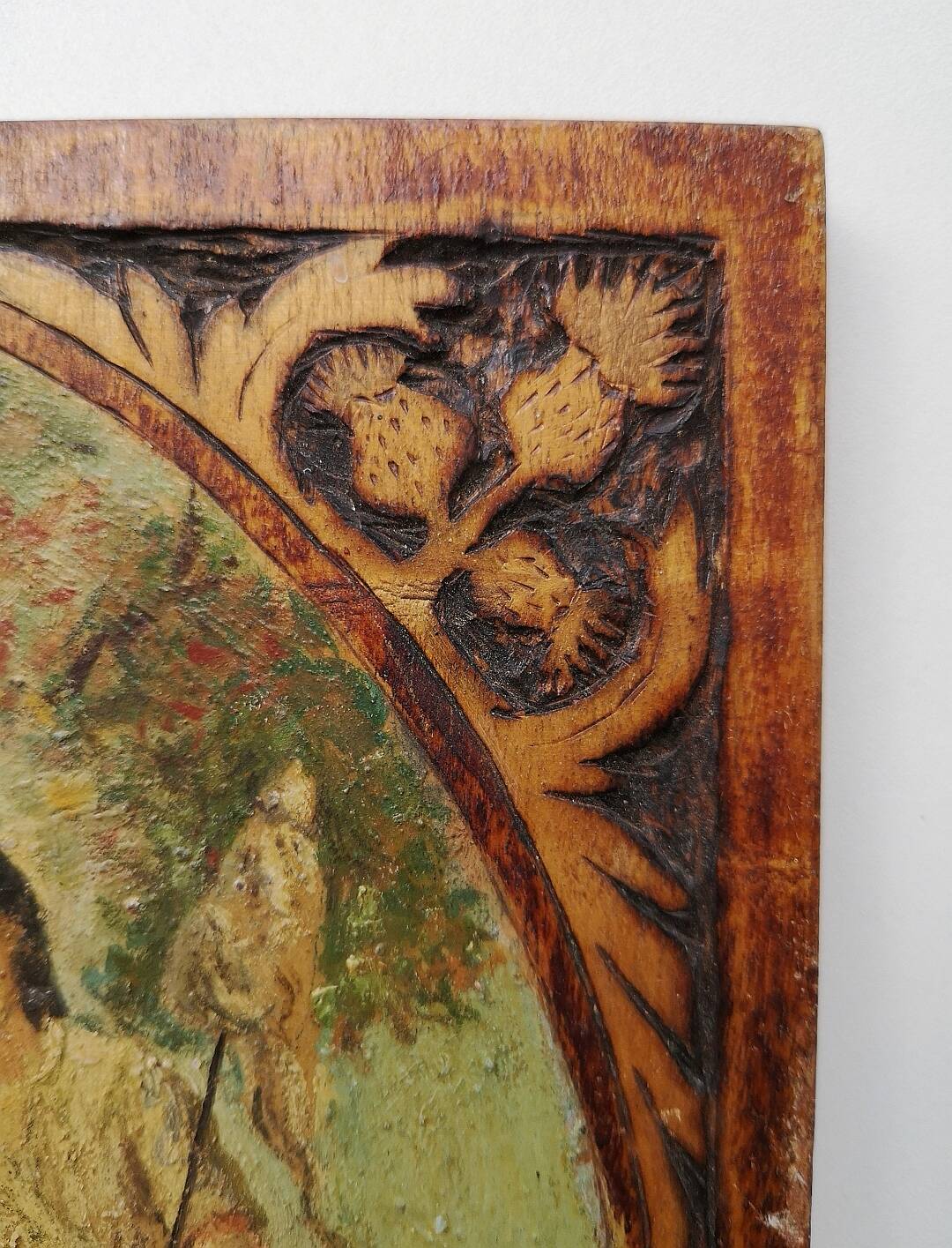 Old oil on wooden panel, carved contours