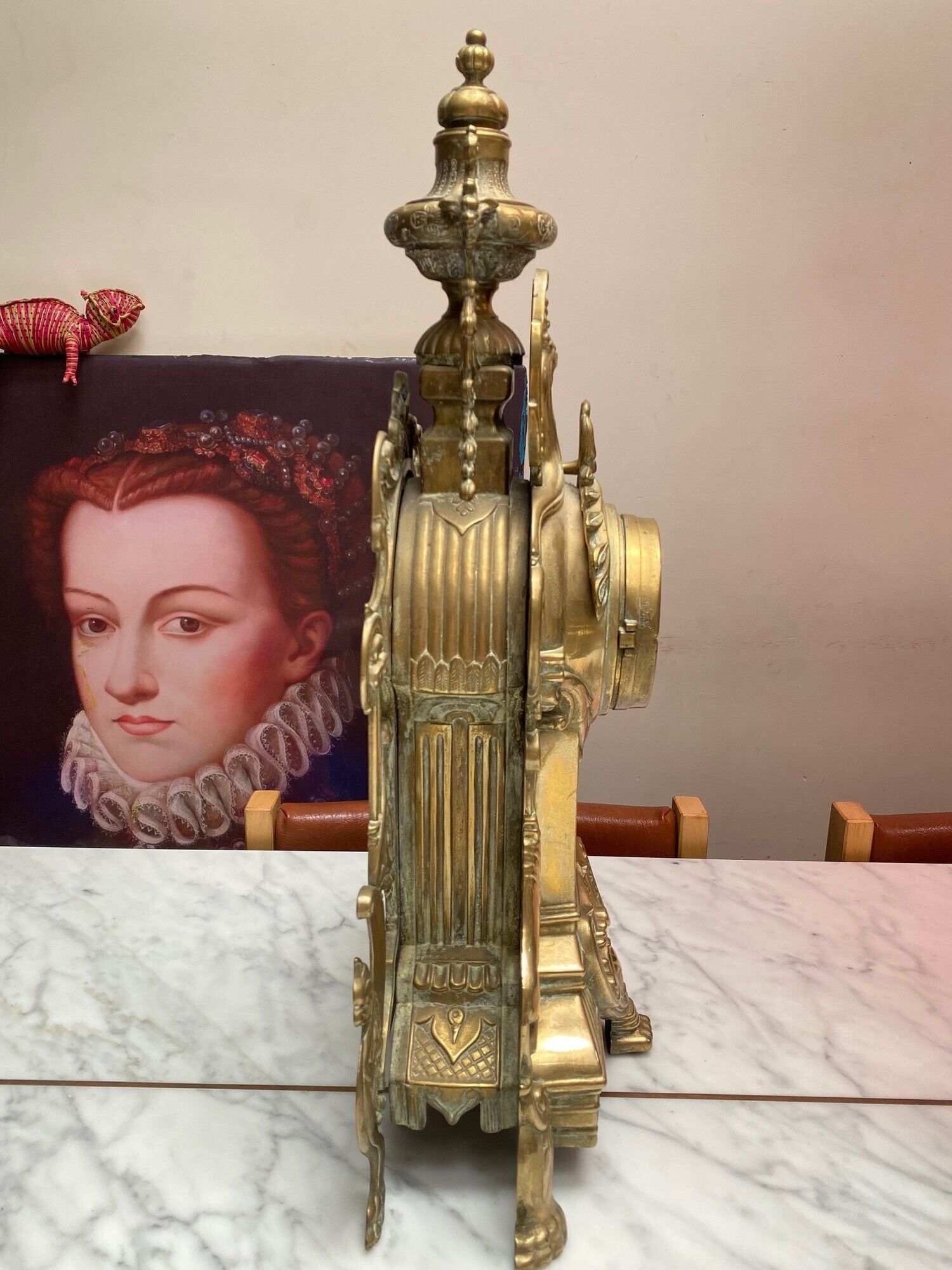 Fireplace trim clock and adornment of antique bronze candelabra