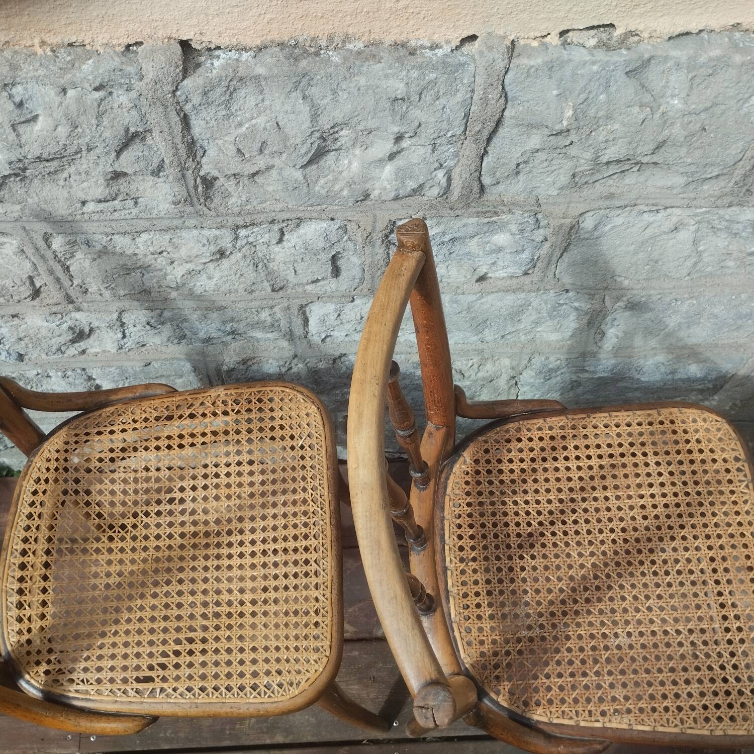 Set of 2 antique bistro chairs. Curved and turned wood.