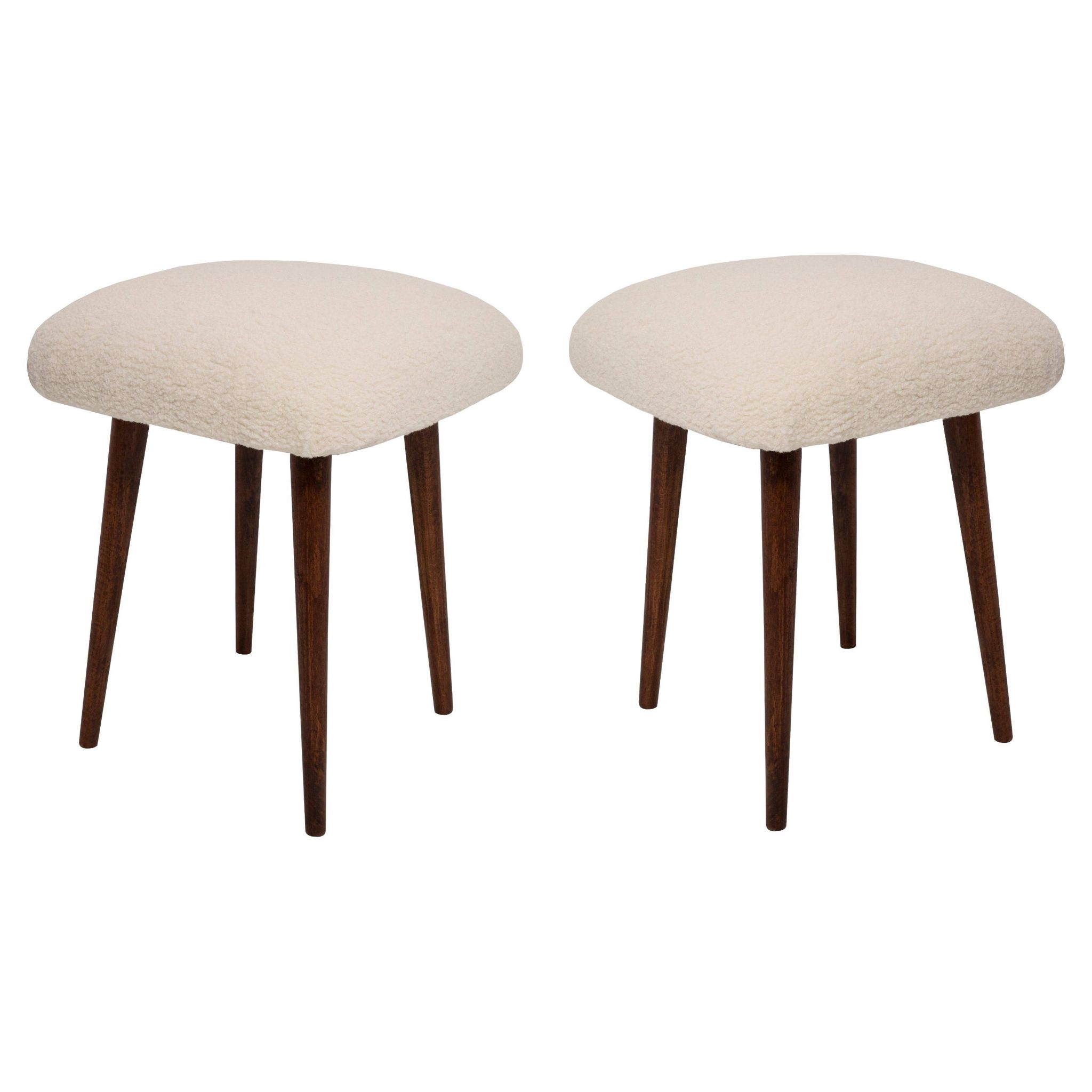 Set of two mid-century modern light beige boucle stools, Europe, 1960s.