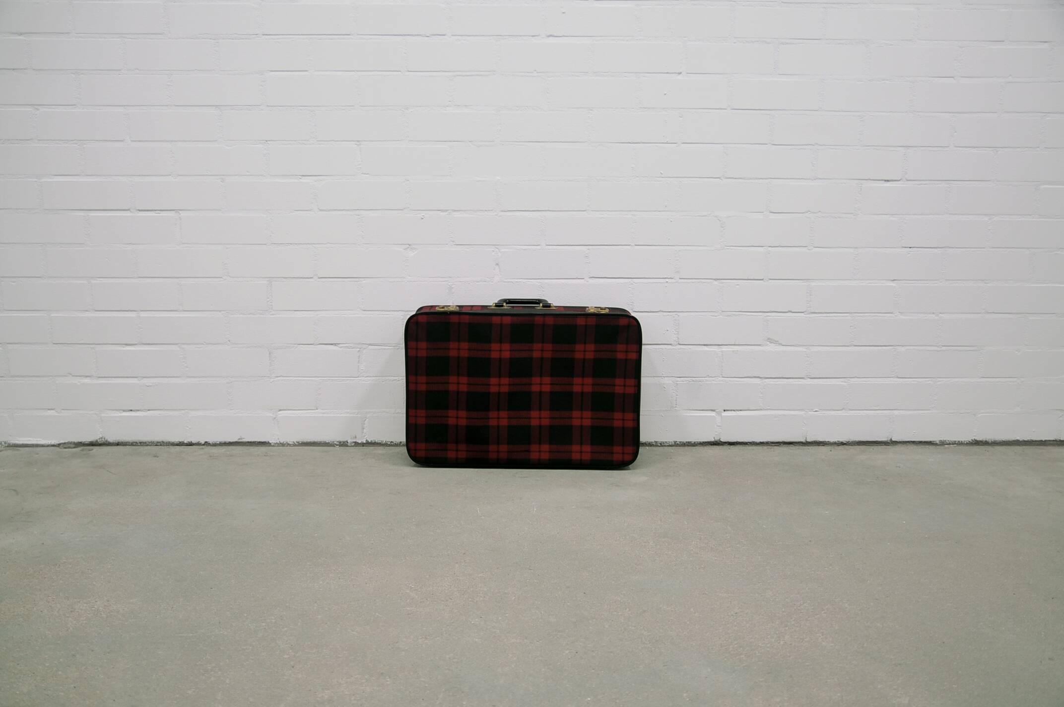 Vintage red checkered suitcase