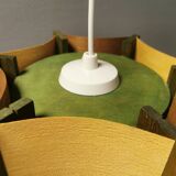Older lamp in wood veneer, partially painted in green colour.