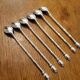 6 long silver-plated metal spoons