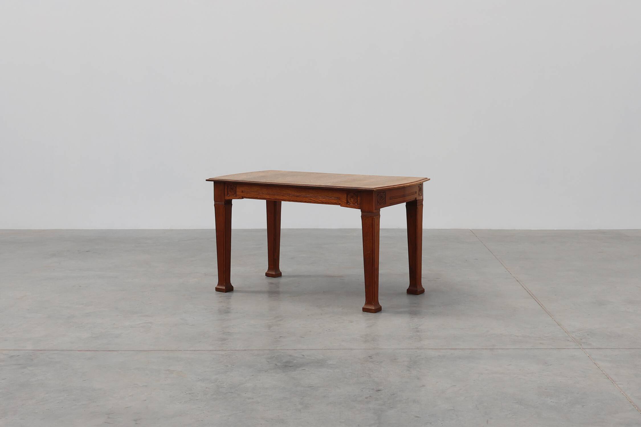 Oak Art Deco dining table with carved frieze, France 1920s