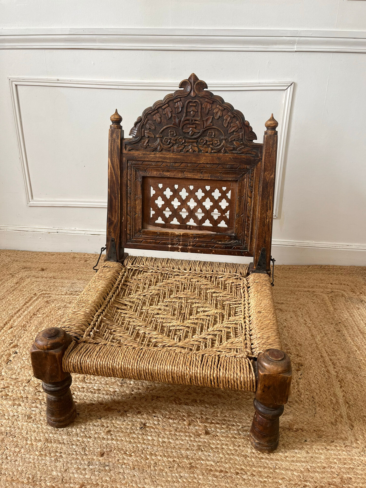 Traditional Indian low chair made of wood and rope.