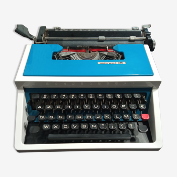 Blue Underwood 315 portable typewriter with its carrying case