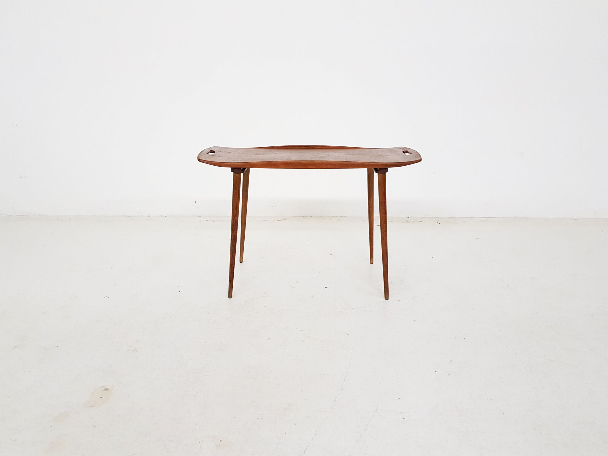 Teak side table with handles by Jens Quistgaard