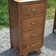 Vintage oak chest of drawers with tapered legs from the 1950s.