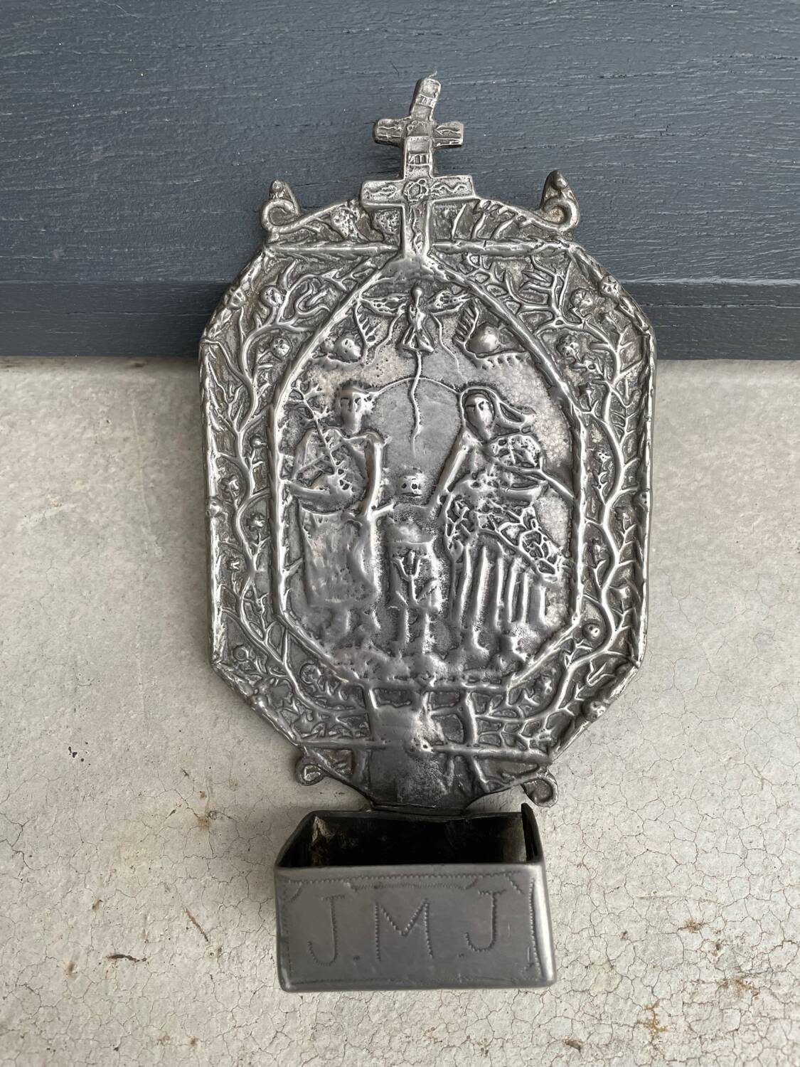Small wall-mounted holy water font