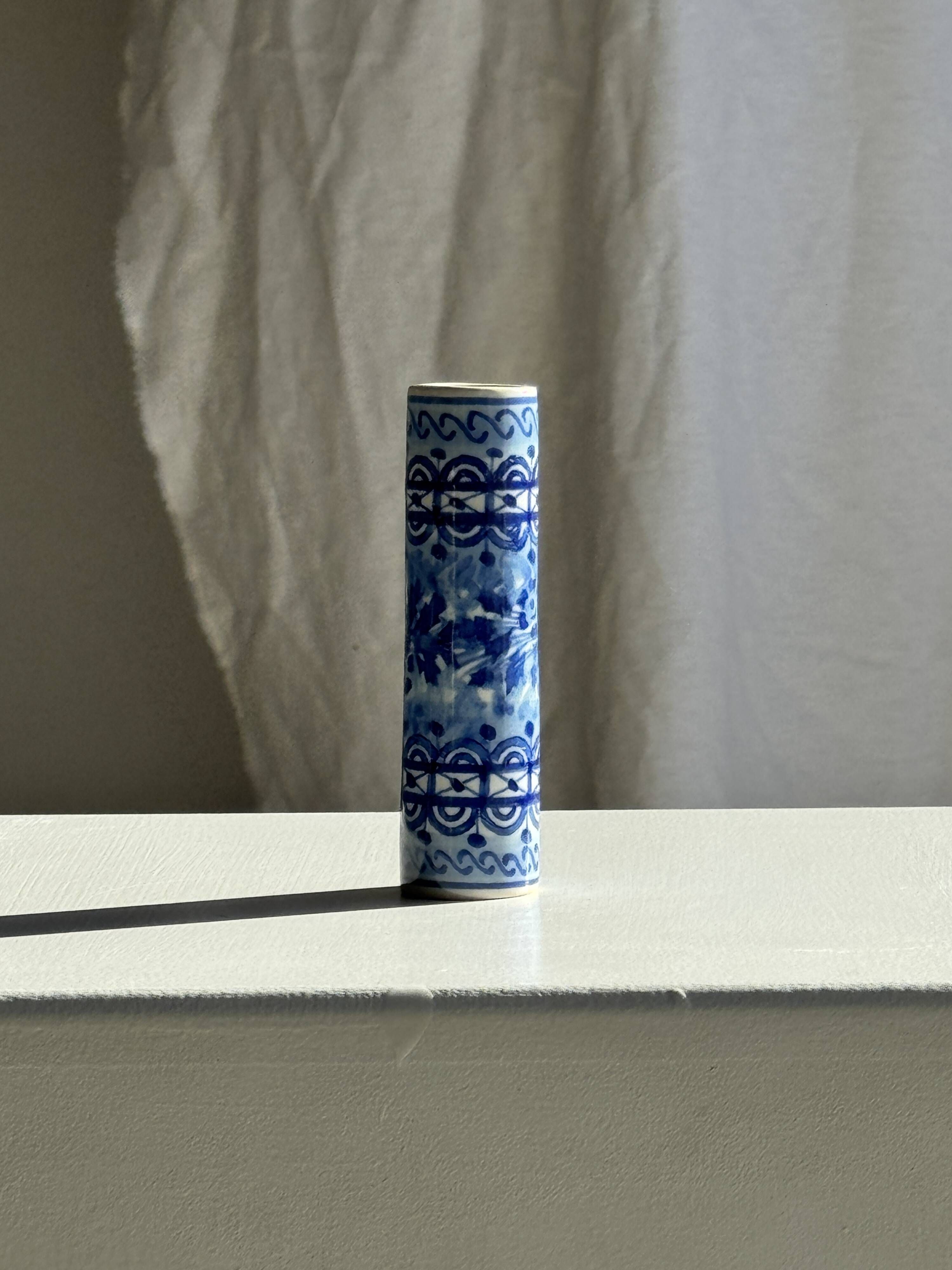 Vintage blue and white earthenware soliflore vase from Portugal.