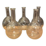 Suite of 5 bakings, bottles with long glass neck