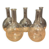 Suite of 5 bakings, bottles with long glass neck