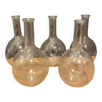 Suite of 5 bakings, bottles with long glass neck