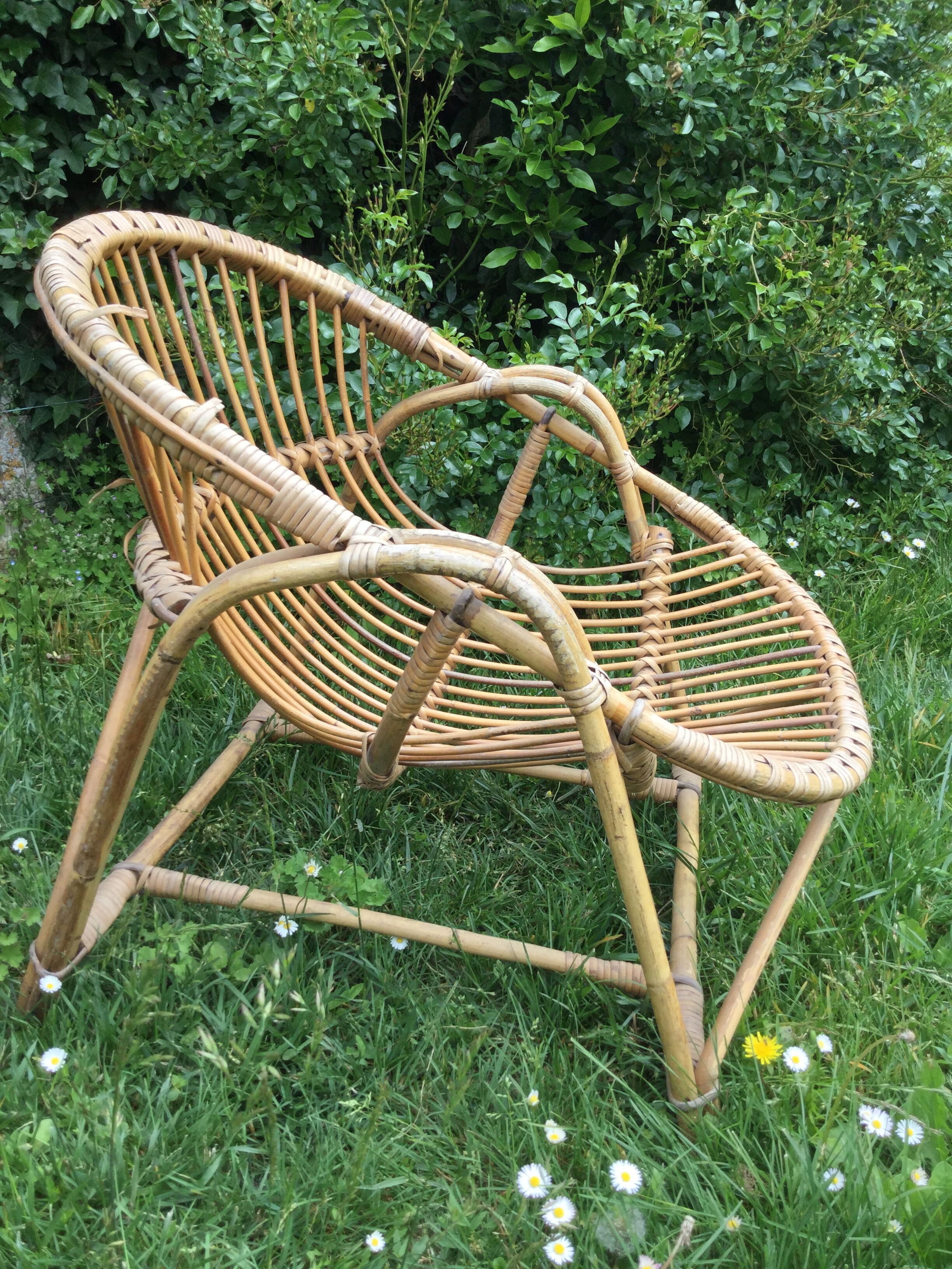 A pair of rattan armchairs