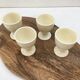 Series of four vintage ceramic coquetiers