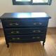 Louis XV style black and gold commode