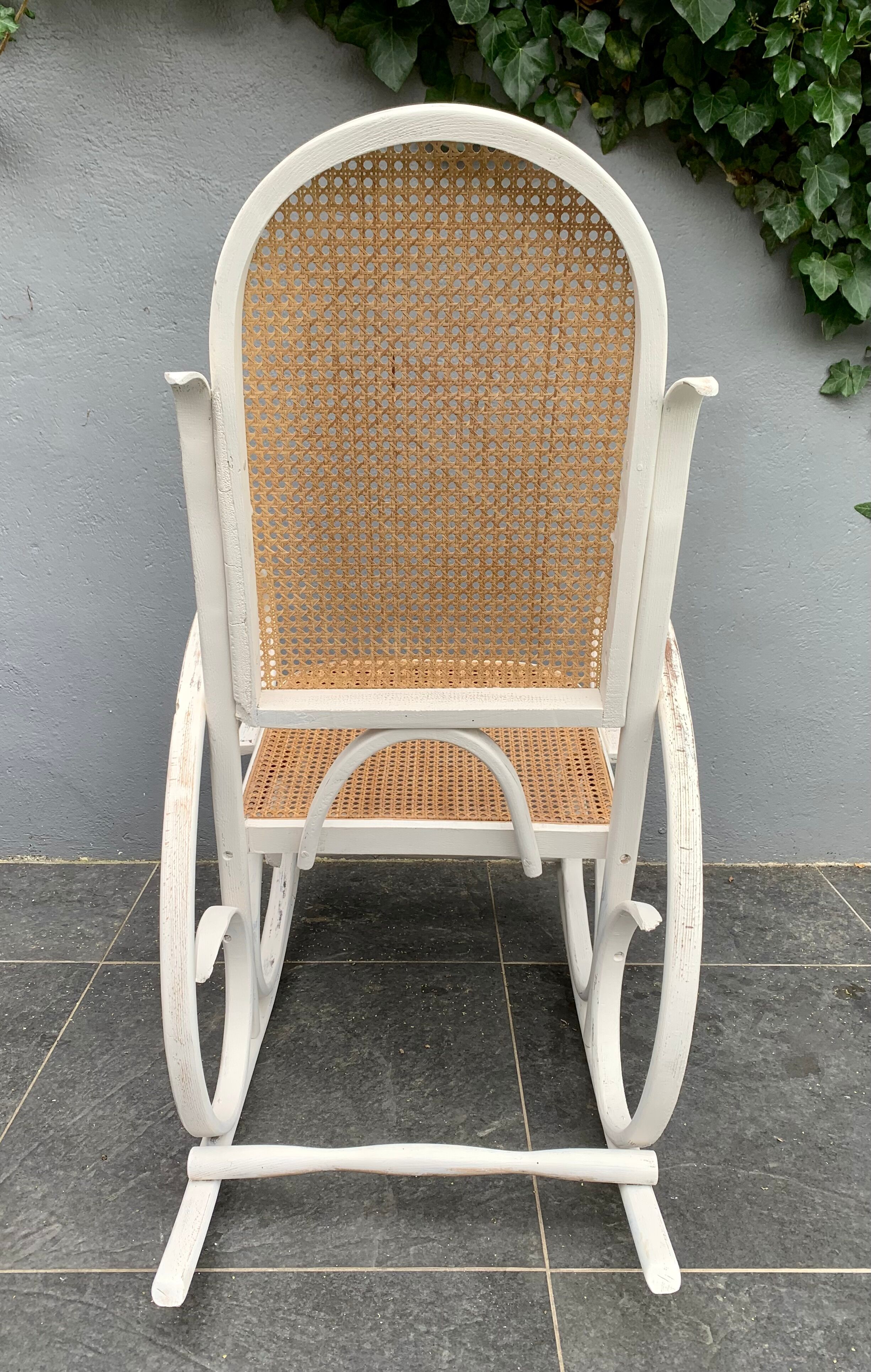 Old rocking chair with white patina