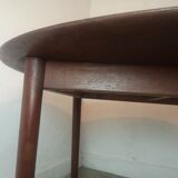 Scandinavian extendable round dining table in teak