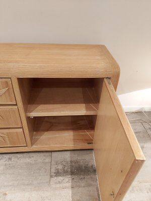 Vintage wicker sideboard with flowers