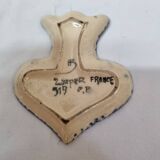 HB Henriot earthenware cup rests tea strainer