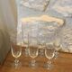6 chiseled champagne flutes made of transparent glass