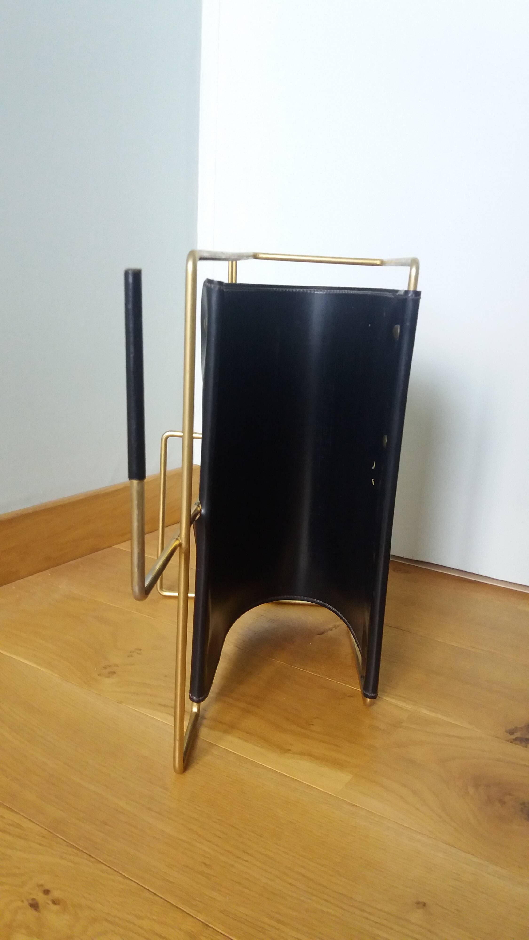 Modernist magazine rack in the style of Jacques Adnet