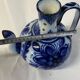 Glazed ceramic carafe with floral decoration