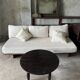 Antique round coffee table in Indonesian teak with turned legs.